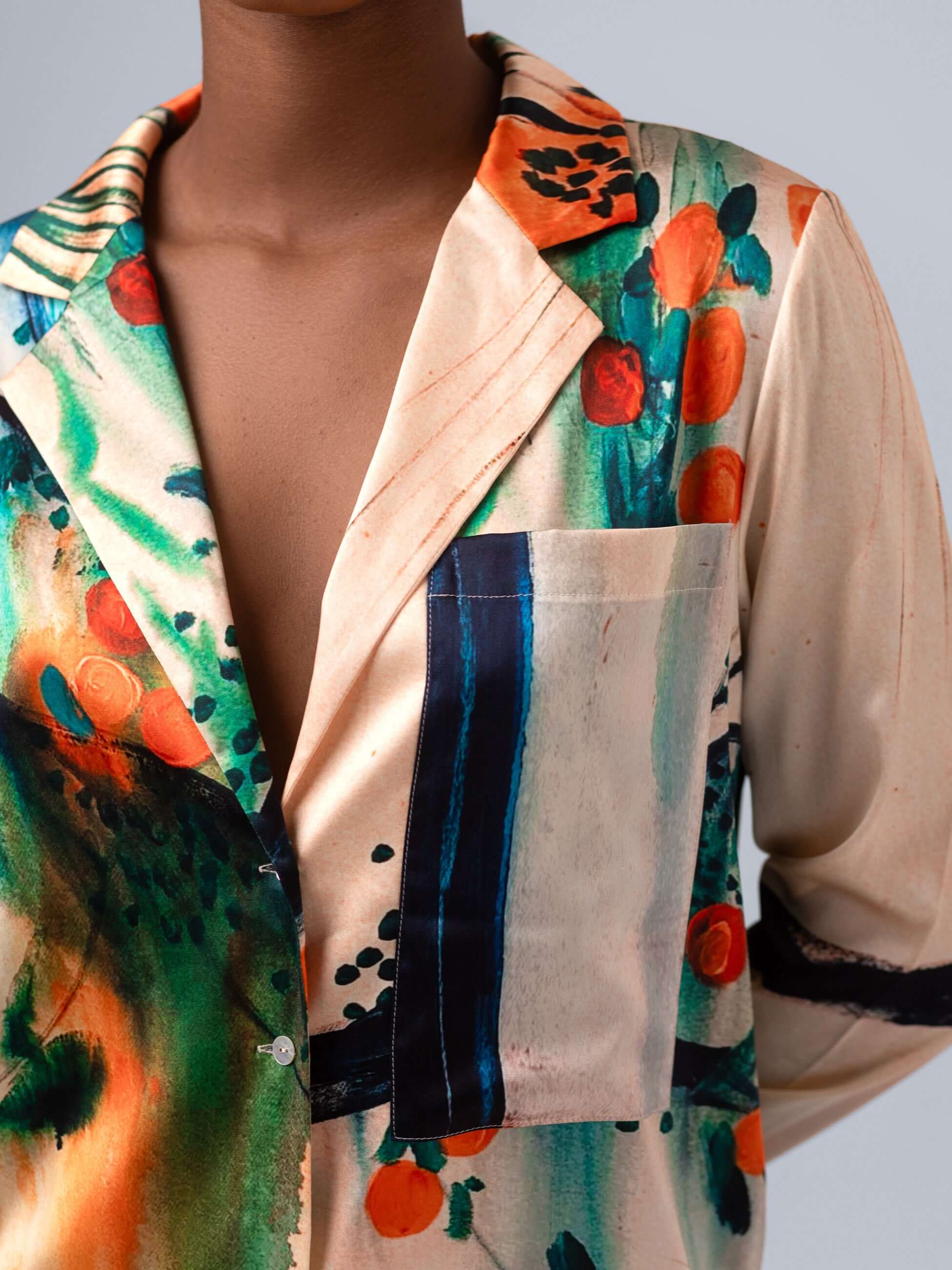 Close-up of the Les Orangers shirt vest with multicolor floral print and structured design features.